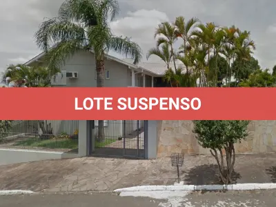 LOTE 018 - O imóvel na Rua Minuano nº 880, sendo um terreno com um prédio residencial, em alvenaria, sob a numeração 880, com o respectivo terreno situado no bairro Liberdade