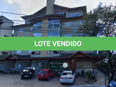 LOTE 012 - 1/3 sobre o box de vaga de garagem, sob numeração 100, do Edifício Residencial e Comercial Belluno Boulevard, na avenida Osvaldo Aranha, número 570, situado na cidade de Canela/RS