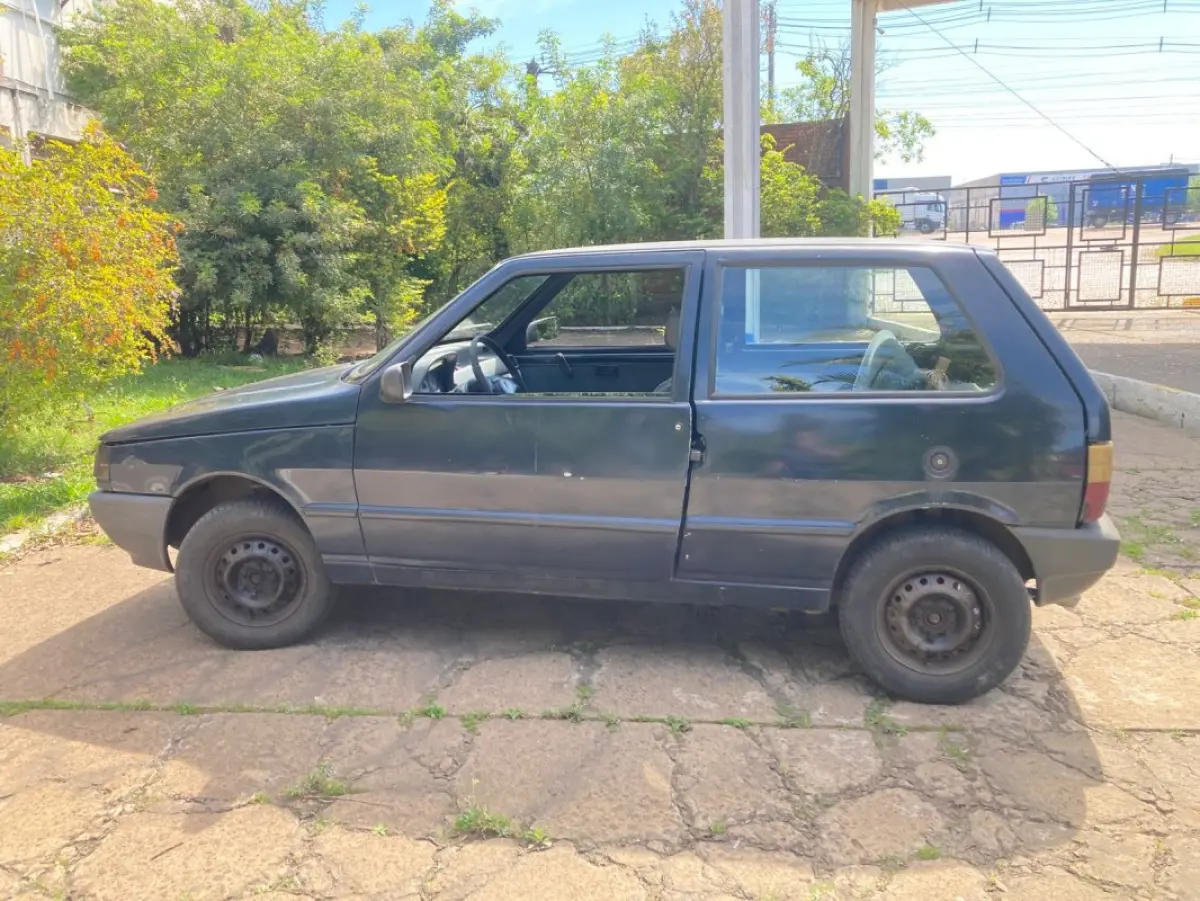 LOTE 034 - Fiat Uno Mille Fire, fabricação/modelo 2002/2003, cor azul