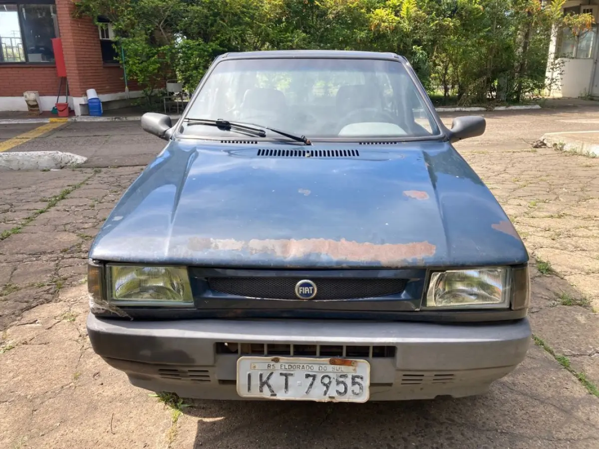 LOTE 034 - Fiat Uno Mille Fire, fabricação/modelo 2002/2003, cor azul