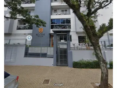 LOTE 039 - Apartamento sob a numeração 501 e box 54, localizado no Edifício Munique Palace, situado no bairro Centro na cidade de Portão/RS, unidade localizada no quarto andar ou quinto pavimento