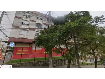 LOTE 000 - 	Um prédio de esquina, situado na Avenida Bento Gonçalves, nº 1820 e 1828, na esquina com a R. Veríssimo Rosa