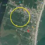 LOTE 002 - terreno, de forma retangular, sob n° 02, da quadra n° 93, do loteamento “Cidade Balneária Luzemar”,  área total de 360,00 m