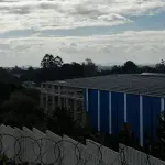 LOTE 002 - Pavilhão industrial na cidade de Alvorada, terreno com a área de 24.284,50m2, constituído dos lotes números 1 ao 8 da Qua-dra A, formada pela Estrada Candido Pinheiro de Barcelos